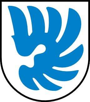 Blue stylized bird on a white shield with a blue border (heraldic logo)