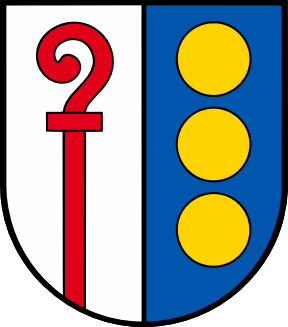 Coat of arms: shield split white left and blue right; left features a red curved staff with a loop and crossbar, right shows three stacked yellow circles.